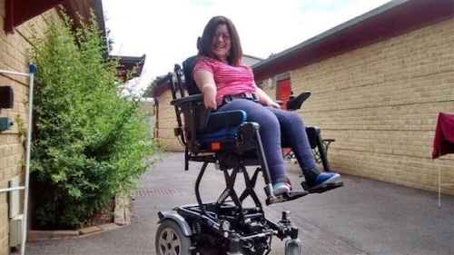 Emma raised up in her wheelchair