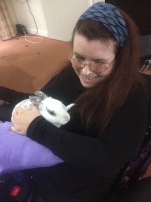 Emma holding Mickey the rabbit