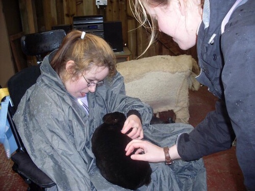 Emma holding black bunny