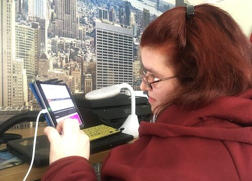 Emma working from home on her iPad