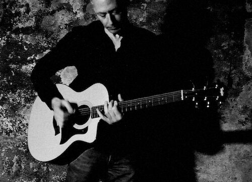 Sano Hill using guitar