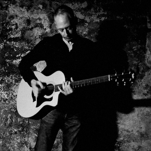 Sano Hill using guitar