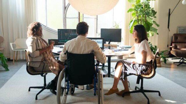 Wheelchair-user-working-at-a-desk
